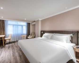 Hanting Hotel Center Station - Wu-si - Ložnice