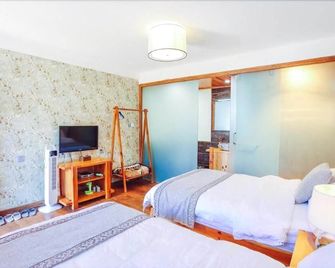 Cabin 7 Inn - Dali - Habitación