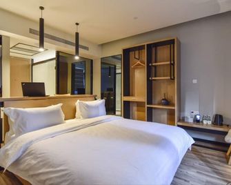 City Inn Oct Loft - שנג'ן - חדר שינה