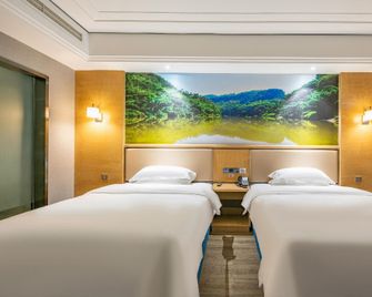 Baihai Holiday Inn - Leshan - Camera da letto