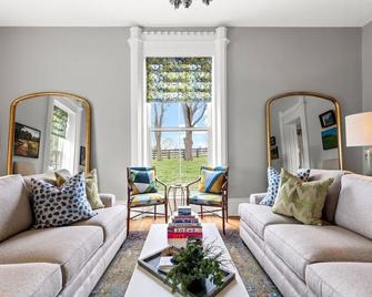 This 19th century farmhouse has been given new life with a thoughtful restoration by Castle & Key - Nicholasville - Living room