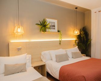 Hotel Bell Repos - ปลาตฮา ดาโร - ห้องนอน