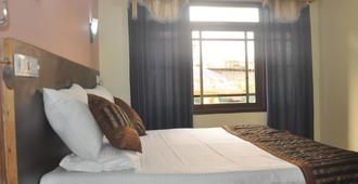 Hotel Kashmir Inn - 斯利那加 - 臥室