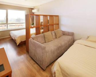 Dalian Zhongchen International Apartment - Dalian - Bedroom