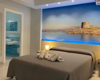 103 Boutique Hotel Stintino - Stintino - Bedroom