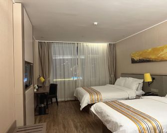 Home Inn Plus Qingdao Licang Jiushui East Road Wanda Plaza - צ'ינגדאו - חדר שינה