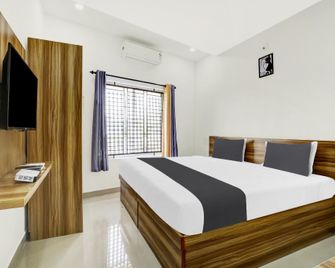 Hotel O Grand Parassini - Kannur - Bedroom