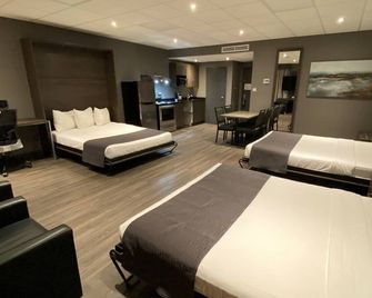 Hotel & Suites Le Dauphin Drummondville - Drummondville - Bedroom