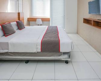 Hotel O Cikarang Near Apartment Riverview Jababeka - Bekasi - Schlafzimmer