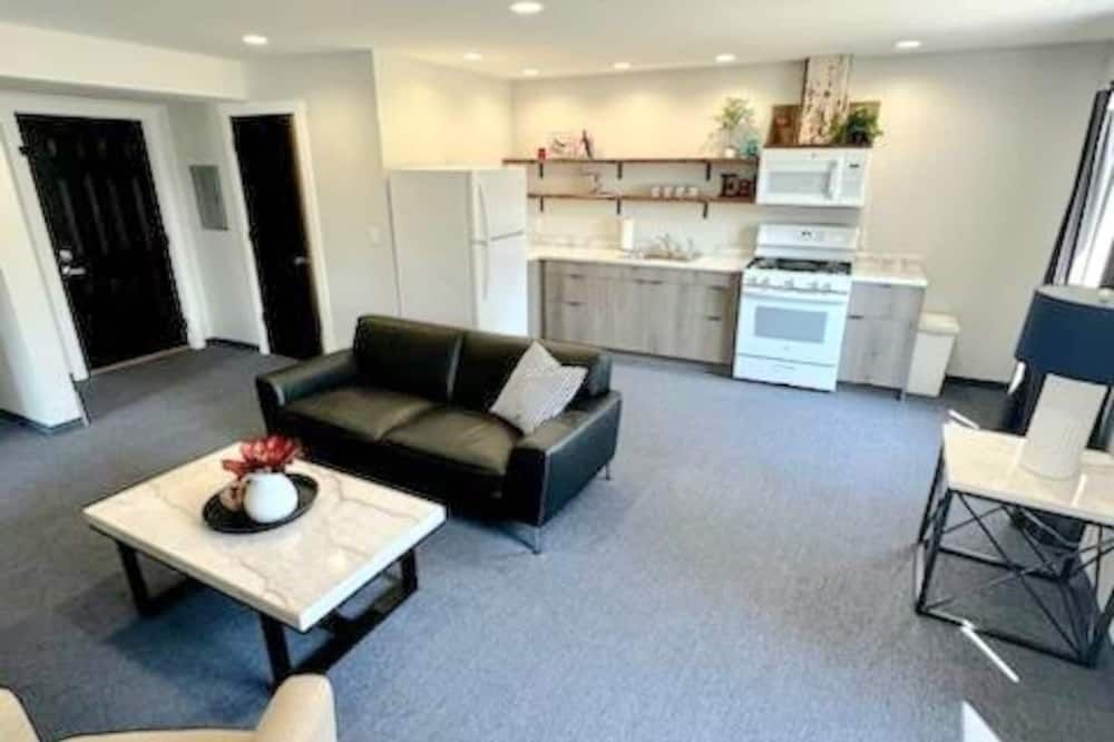 Cozy 2-bedroom suite with full kitchen, living room (couch, 2 chairs), dining table (2 stools), smart TV with cable. Perfect for short or long stays. This suite is one the 2nd level and requires guest to use stairs