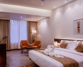 The Hotel Ambience - Pune - Bedroom