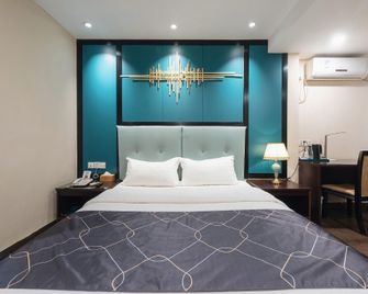 Chonpines Hotel · Chengxiang ( Heyuan Railway Station Top Fountain of Asia) - Heyuan - Camera da letto