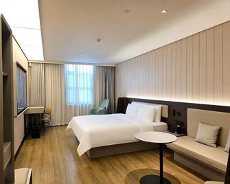 Hanting Hotel (Zhengzhou Weilai Road Manhattan) - Женжоу - Спальня