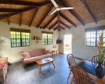 Eco-Cottage 1-bed set in tropical gardens - Calibishie - Living room