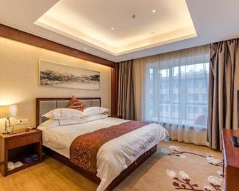 Junhe International Hotel - Bengbu - Schlafzimmer
