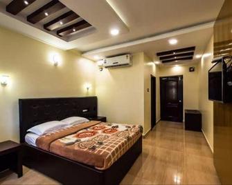 Hotel Victoria - Thalassery - Camera da letto