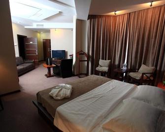 Grand M Hotel - Navoiy - Bedroom