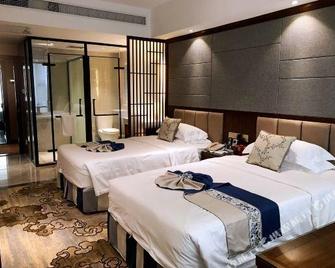 Zhangzhou Yinjia Hotel (Gucheng Branch) - Zhangzhou - Schlafzimmer
