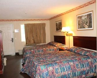 Magnolia Bay Hotel & Suites - Jonesboro - Bedroom