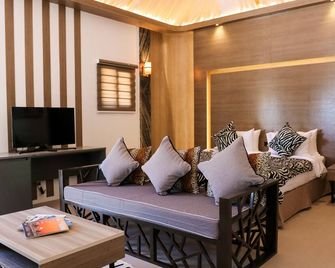 Safari Hotel and Villas powered by Cocotel - Vigan City - Wohnzimmer