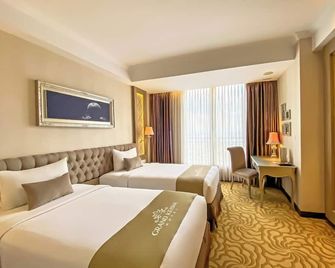 Grand Keisha Yogyakarta - Yogyakarta - Schlafzimmer