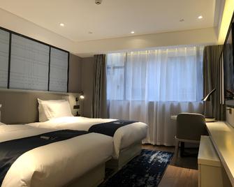 Echarm Hotel Wuzhou Canghai Lake High Speed Railway Station - Wuzhou - Bedroom