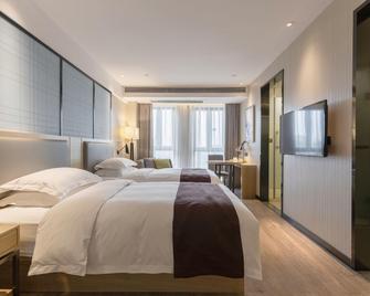 Echarm Hotel Chongqing West Railway Station - Chongqing - Habitación