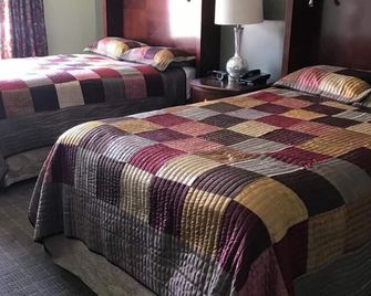 CCI Express Inn - Central City - Bedroom