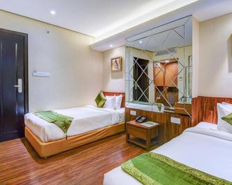 Treebo Sapphire Star - Indore - Camera da letto