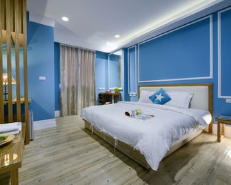 كينتنج كوست ريزورت - Hengchun Township - غرفة نوم