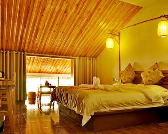 Assembly Inn - Zhangjiajie - Schlafzimmer