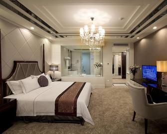 Country Garden Phoenix Hotel Zhaoqing - Zhaoqing - Camera da letto