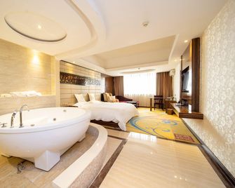 Nanning Xilaifeng Hotel - Nanning - Slaapkamer