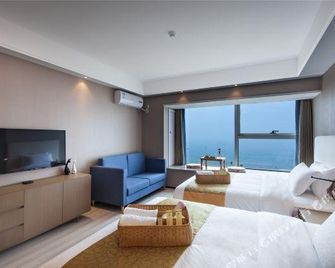 Qingdao Meitu Seaview Resort Apartment (Convention and Exhibition Center Shilaoren Bathing) - Qingdao - Living room