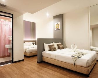 Yan Hotel - ג'ורג' טאון - חדר שינה