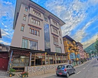 كامسوم إن - ثيمفو - مبنى