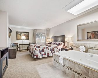 Guest House Inn & Suites - Edson - Camera da letto