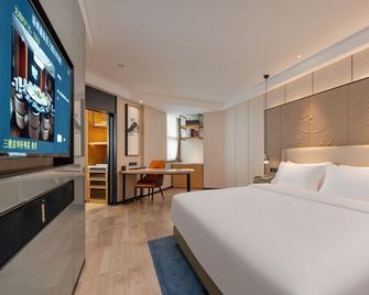 Zibo Taixing Hotel (Railway Station Badaju Branch) - Zibo - Slaapkamer