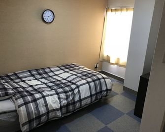 هوستل بي إيه كيو توكوشيما - دار ضيافة - توكوشيما - غرفة نوم