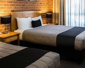 Akuna Motor Inn And Apartments - דובו - חדר שינה