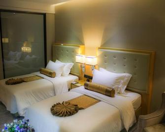 Golden Phoenix International Hotel - Zhaoqing - Спальня
