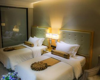 Golden Phoenix International Hotel - Zhaoqing - Schlafzimmer