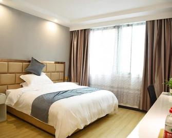 Shell Lishui High Speed Railway Station Hotel - Lishui - Schlafzimmer