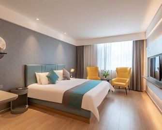 Magnotel Hotel Liaocheng Development Zone Zhenhua Shopping Center - Liaocheng - Schlafzimmer