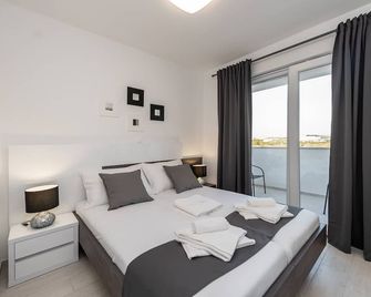 Apartments & Rooms Pool Villas Maris - Novaglia - Camera da letto