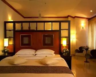 Nani Hotels & Resorts - Kollam - Bedroom