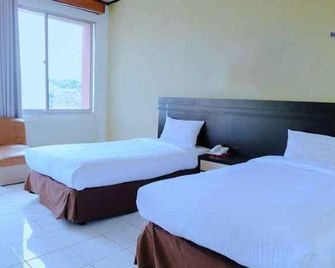 Bandung Permai Hotel Jember - Jember - Schlafzimmer
