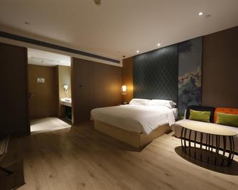 فندق إيبيس ستايلز أكس إم تشونغشان - شيامن - غرفة نوم