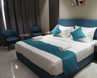 Hotel Tulips inn by VKG - Gulbarga - Bedroom