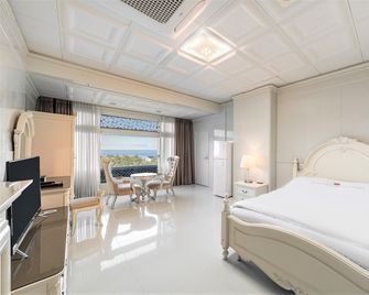 Donghae Boyang Hot Spring Convention Hotel - Donghae - Camera da letto